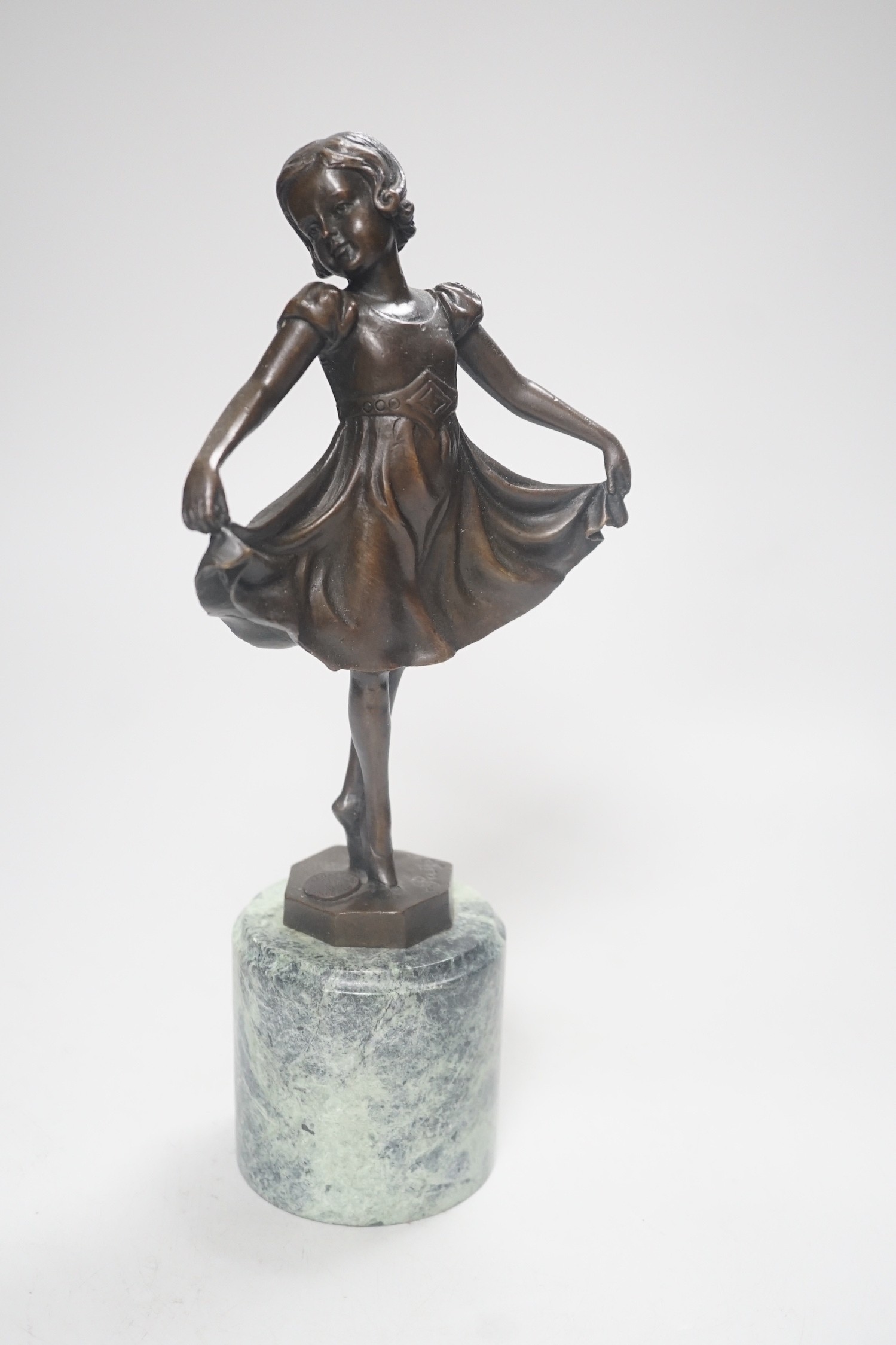 After Ferdinand Preiss (1882-1943), a bronze of a curtsying girl, on marble base, 27cm